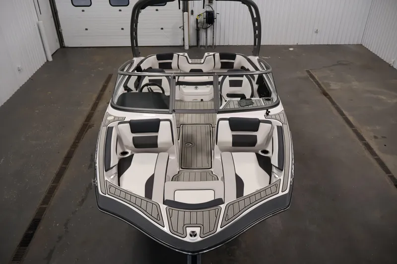 Slide: The Image of 2020 Yamaha Boats 195S interior, showcasing sleek seating and modern design in a spacious layout. - 9