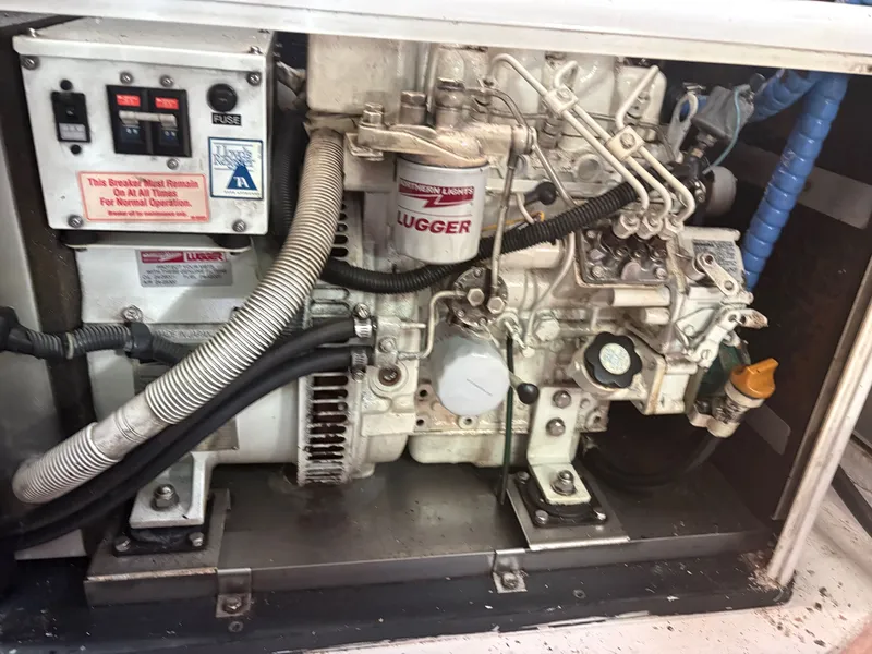 Slide: The Image of Engine compartment of a 1983 Wilbur 38 Flybridge with Lugger engine. - 32