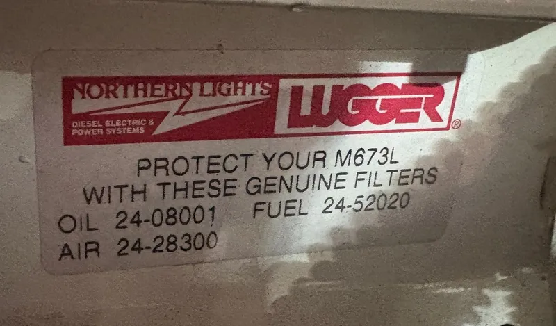 Slide: The Image of Northern Lights Lugger filter sticker on Wilbur 38 Flybridge 1983. - 33