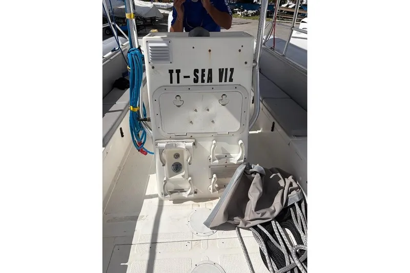 Slide: The Image of 2009 Eduardono RIB boat interior with equipment and storage compartments. - 13