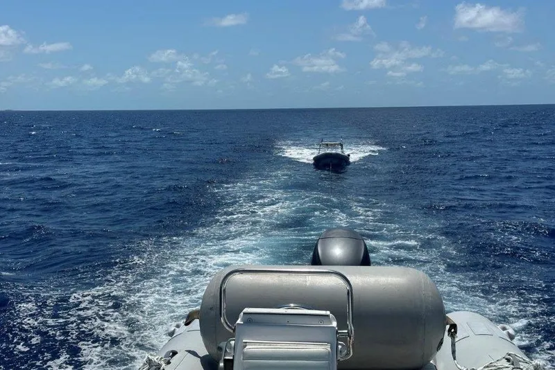 Slide: The Image of 2009 Eduardono RIB boats navigating open sea under clear blue sky. - 4