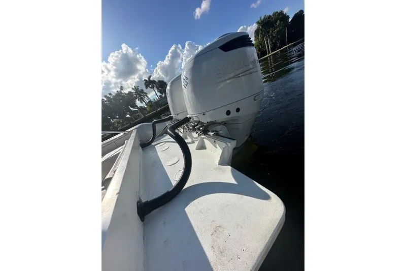 Slide: The Image of 2009 Eduardono RIB boat with Suzuki outboard motor on a sunny day. - 9