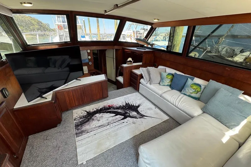Slide: The Image of Interior of 1988 Viking 41 Convertible yacht with modern decor and large windows. - 12