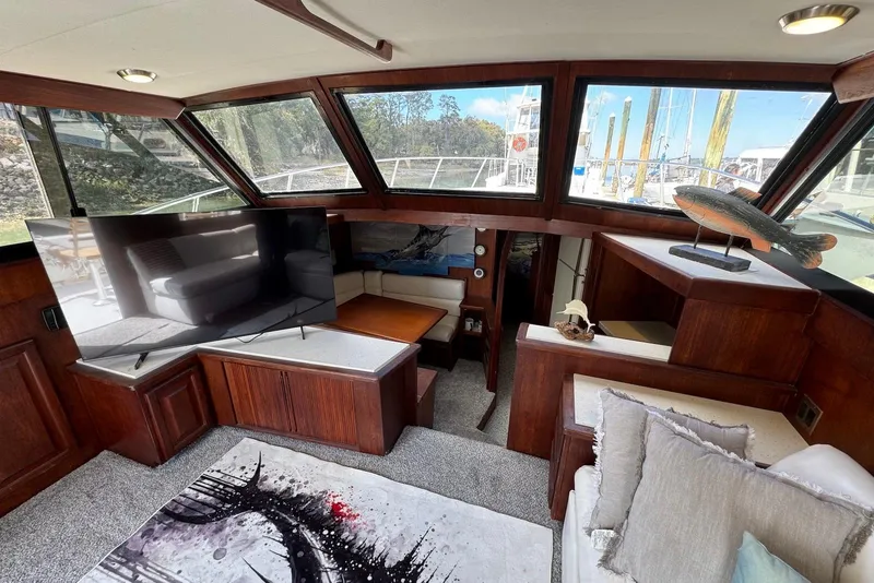 Slide: The Image of Interior of 1988 Viking 41 Convertible yacht with modern decor and large windows. - 14