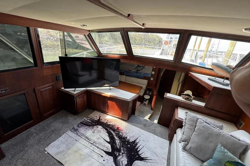 Slide: The Image of 1988 Viking 41 Convertible yacht interior with modern decor and large windows. - 15