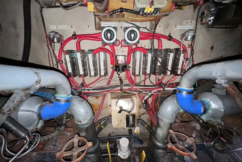 Slide: The Image of Engine room wiring and components of a 1988 Viking 41 Convertible boat. - 26