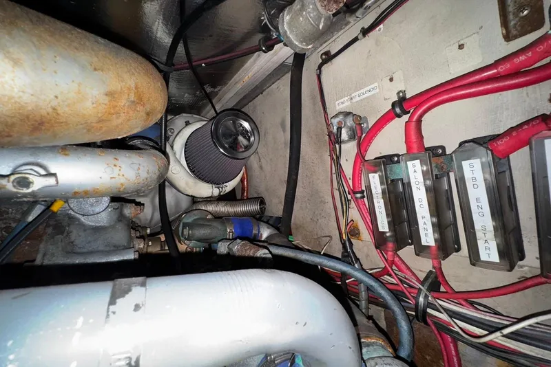 Slide: The Image of Engine room of 1988 Viking 41 Convertible with wiring and components visible. - 27