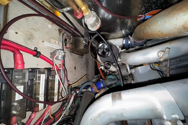 Slide: The Image of Engine compartment of a 1988 Viking 41 Convertible boat, showing wiring and components. - 28