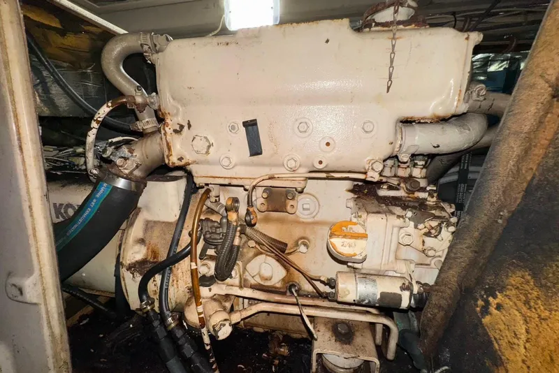 Slide: The Image of Engine of a 1988 Viking 41 Convertible boat, showing wear and rust. - 30