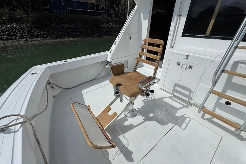 Slide: The Image of 1988 Viking 41 Convertible boat deck with fishing chair and ladder. - 7