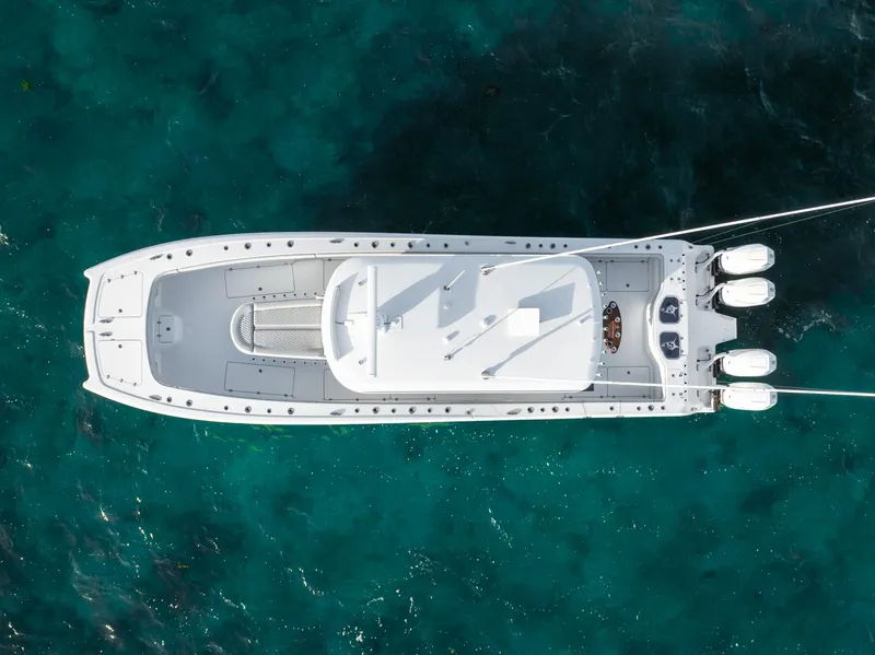 Slide: The Image of Aerial view of 2023 Freeman 43 boat on clear blue water. - 10