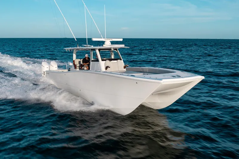 Slide: The Image of 2023 Freeman 43 boat cruising on open ocean waters. - 12