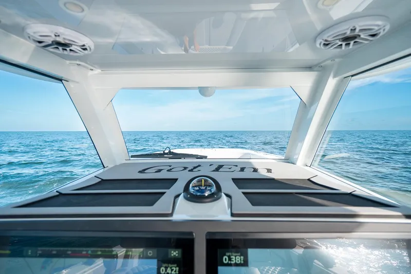 Slide: The Image of Interior view of 2023 Freeman 43 boat, navigating open sea under clear blue sky. - 22