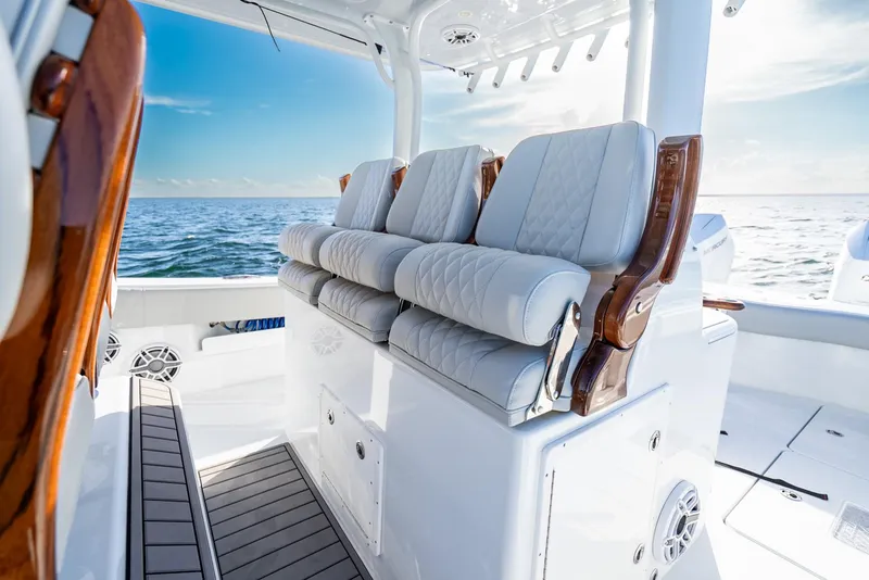 Slide: The Image of Luxurious seating on a 2023 Freeman 43 boat, with ocean view and elegant design. - 28