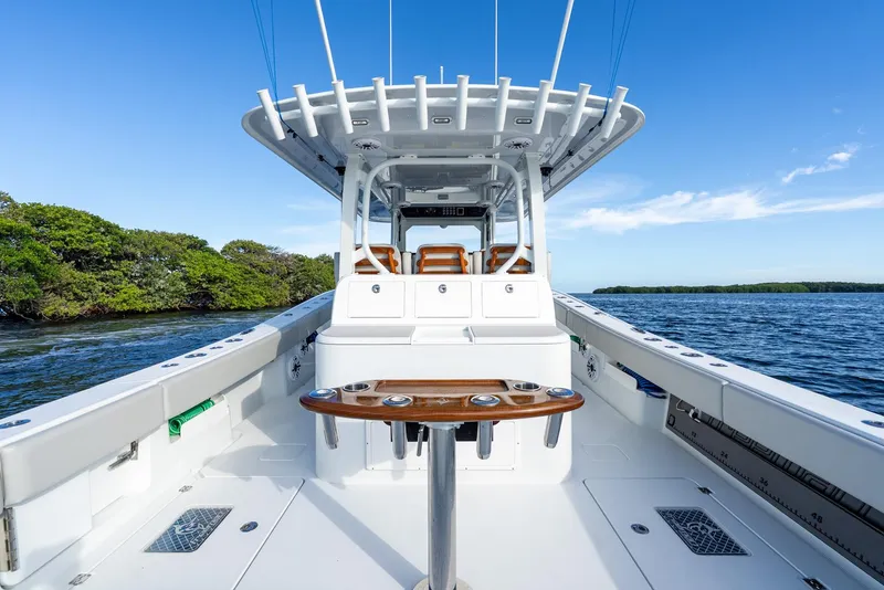 Slide: The Image of 2023 Freeman 43 boat interior with sleek design, on calm blue water under clear sky. - 29