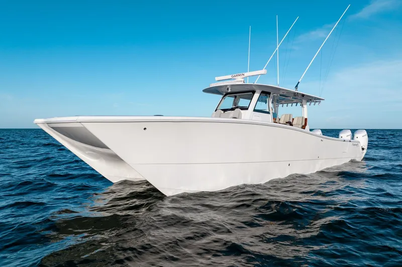 Slide: The Image of 2023 Freeman 43 boat on open sea under clear blue sky. - 3