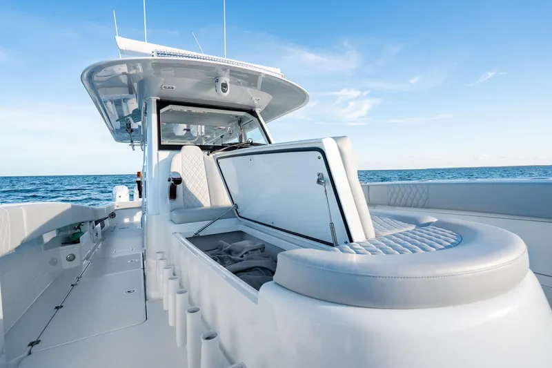 Slide: The Image of 2023 Freeman 43 boat interior with open storage, ocean view, and clear sky. - 38