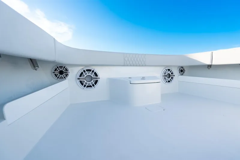 Slide: The Image of 2023 Freeman 43 boat interior with speakers and seating, under clear blue sky. - 39