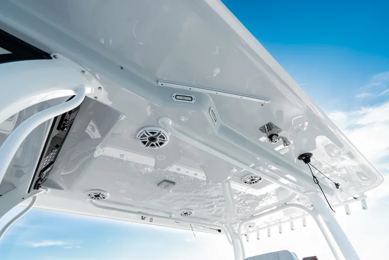 Slide: The Image of 2023 Freeman 43 boat roof with speakers and equipment against blue sky. - 44