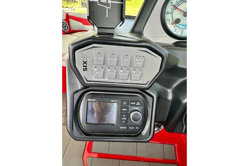 Slide: The Image of 2021 Axis A20 boat dashboard with control panel and Bluetooth stereo system. - 18