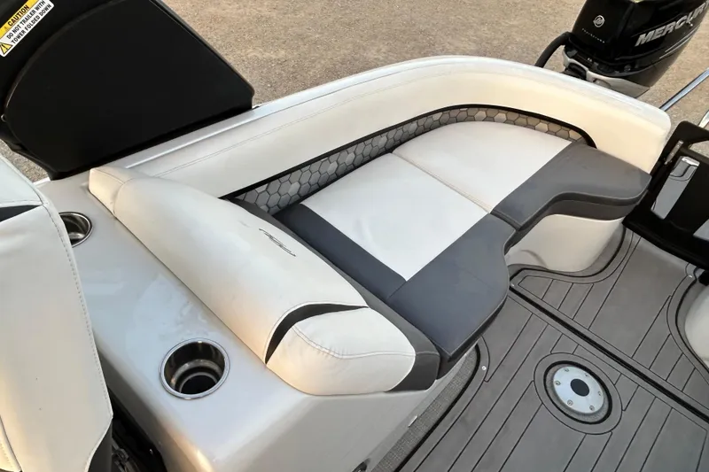 Slide: The Image of Luxurious seating on 2023 Manitou 27 XT RFXW boat with modern design and cup holders. - 12