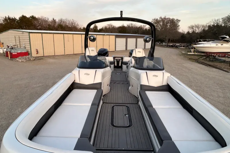 Slide: The Image of 2023 Manitou 27 XT RFXW pontoon boat with sleek seating and modern design. - 7