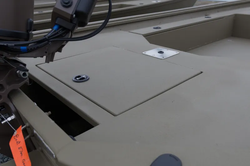Slide: The Image of 2026 G3 Gator Tough 16 DK boat deck with storage compartment and motor wiring. - 10