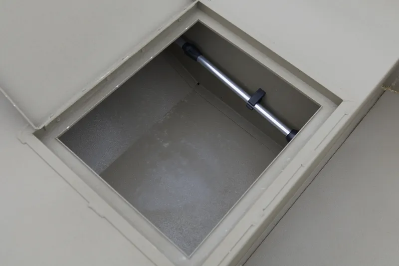 Slide: The Image of Open storage compartment in 2026 G3 Gator Tough 16 DK boat. - 12