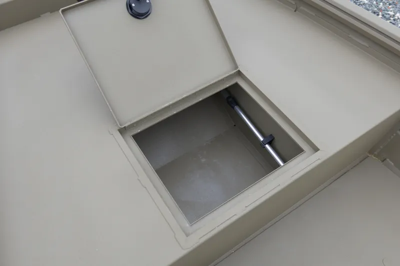 Slide: The Image of Open storage compartment on 2026 G3 Gator Tough 16 DK boat. - 13