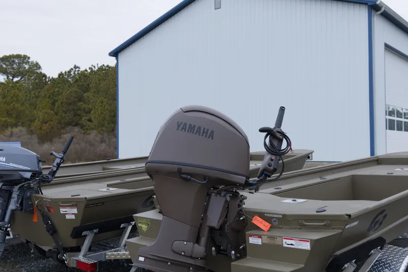 Slide: The Image of 2026 G3 Gator Tough 16 DK boat with Yamaha outboard motor near a building. - 4