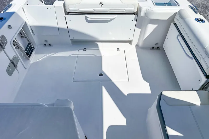 Slide: The Image of 2025 Edgewater 262CX Crossover boat interior with spacious seating and storage compartments. - 35