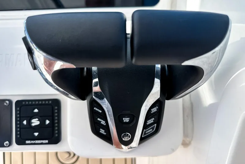 Slide: The Image of 2025 Edgewater 262 CX boat cruising on a sunny day, featuring spacious seating and dual engines. - 34