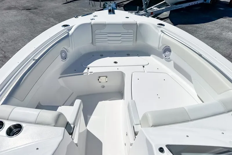 Slide: The Image of 2025 Edgewater 262 CX boat interior with white seating, ocean view, and sleek design. - 41