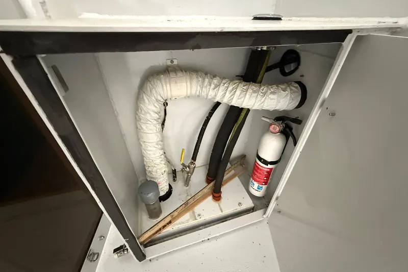 Slide: The Image of Engine compartment of 2013 Eco-Trawler 33 with fire extinguisher and ventilation system. - 16