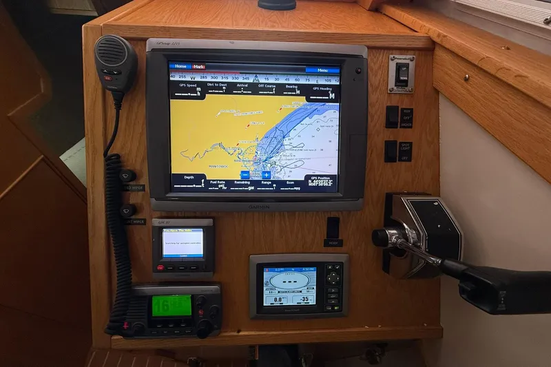 Slide: The Image of Navigation console of 2013 Eco-Trawler 33 with GPS and communication equipment. - 21