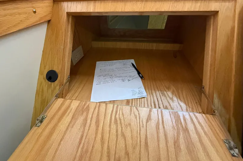 Slide: The Image of Wooden desk with notes and pen inside Eco-Trawler 33, 2013 model. - 27