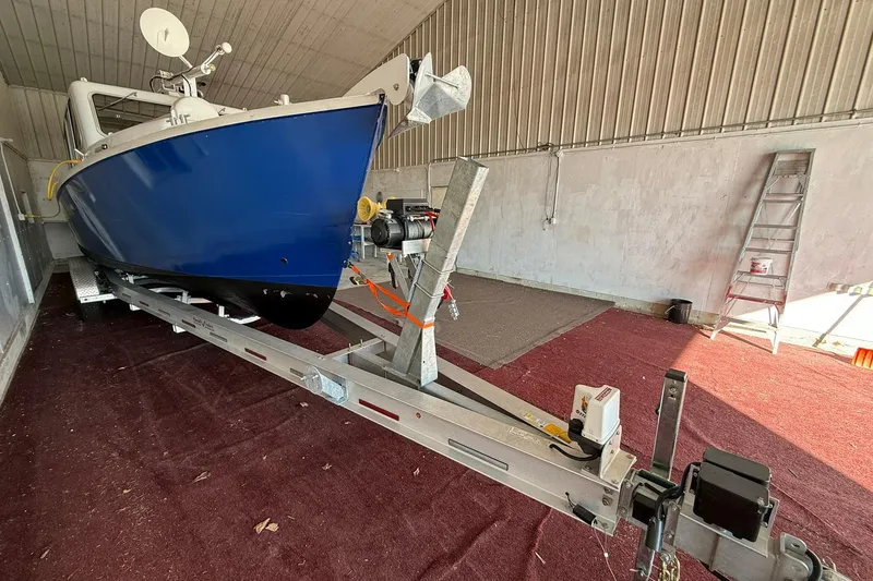 Slide: The Image of 2013 Eco-Trawler 33 on trailer in a storage facility. - 3