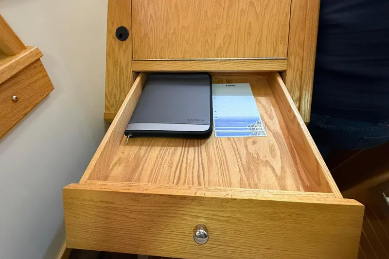 Slide: The Image of Wooden drawer in Eco-Trawler 33, 2013, with Garmin device and notepad. - 35