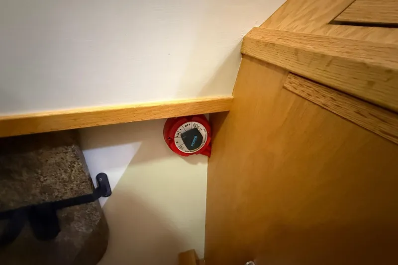 Slide: The Image of Red control dial on Eco-Trawler 33, 2013 model, near wooden panel and wall. - 43