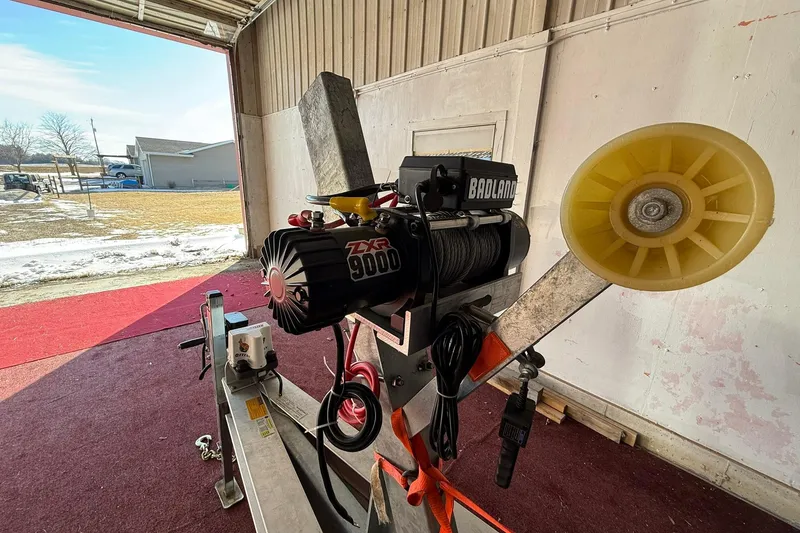 Slide: The Image of Winch system on Eco-Trawler 33, 2013 model, in a garage setting. - 45