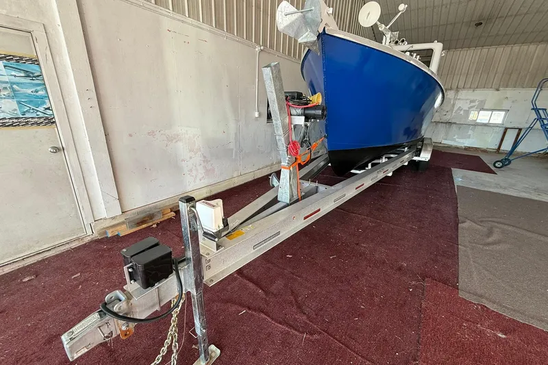Slide: The Image of 2013 Eco-Trawler 33 on trailer in indoor storage facility. - 5