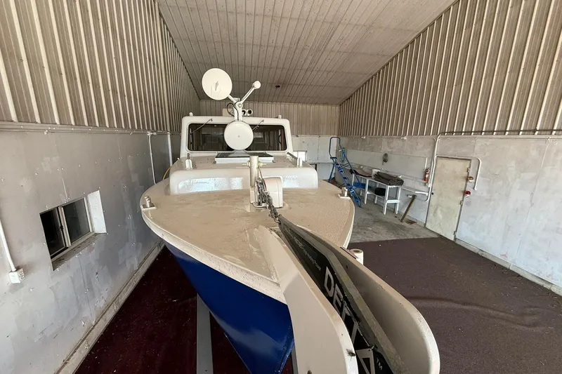 Slide: The Image of Eco-Trawler 33 (2013) in storage, showcasing sleek design and modern features. - 6