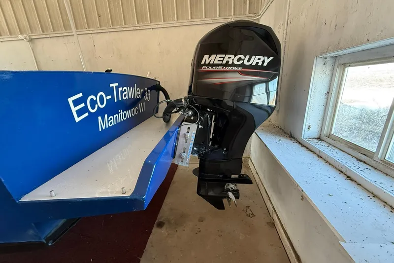 Slide: The Image of Eco-Trawler 33 boat with Mercury outboard motor, 2013 model, in Manitowoc, WI. - 9