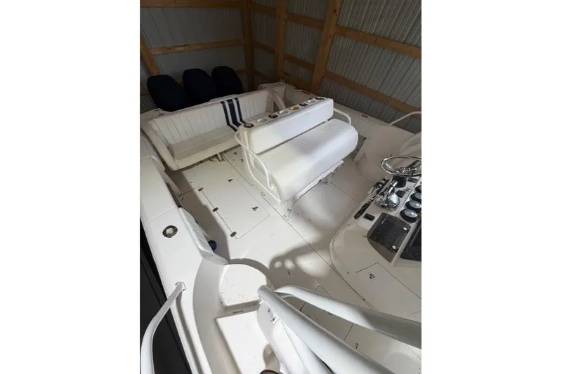 Slide: The Image of 2009 Intrepid 377 Walkaround boat interior with seating and control panel. - 20