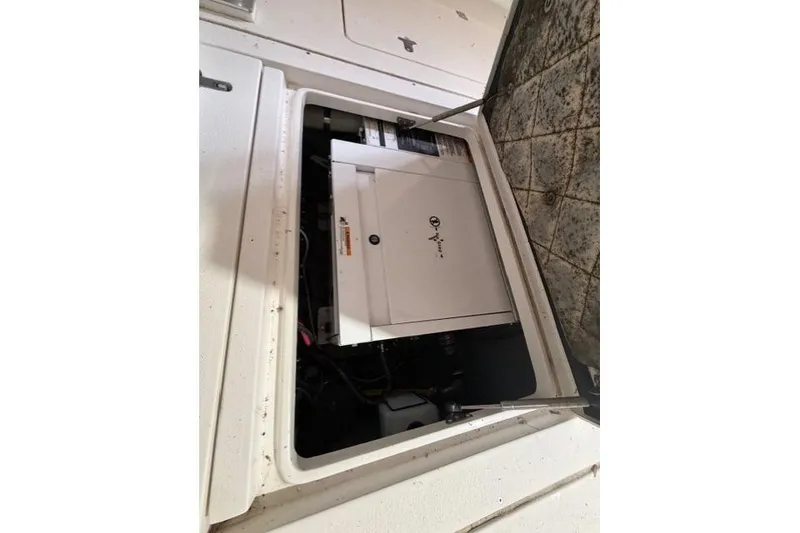 Slide: The Image of 2009 Intrepid 377 Walkaround engine compartment with open hatch, showcasing internal components. - 27