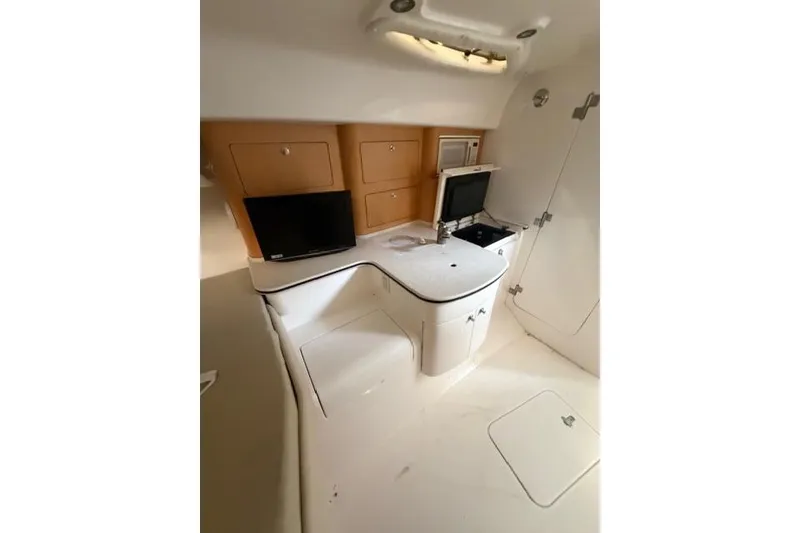 Slide: The Image of 2009 Intrepid 377 Walkaround cabin interior with modern amenities and sleek design. - 33