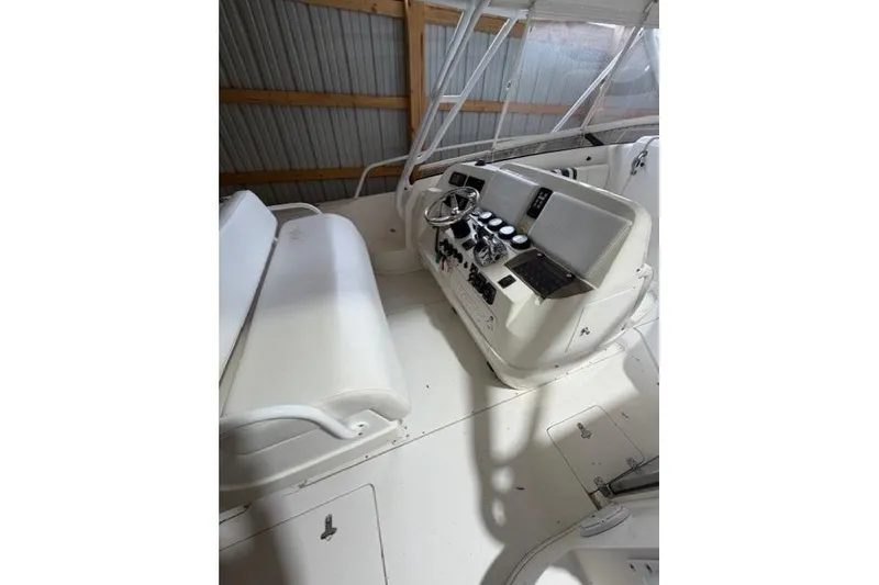 Slide: The Image of 2009 Intrepid 377 Walkaround boat interior with helm and seating area. - 34
