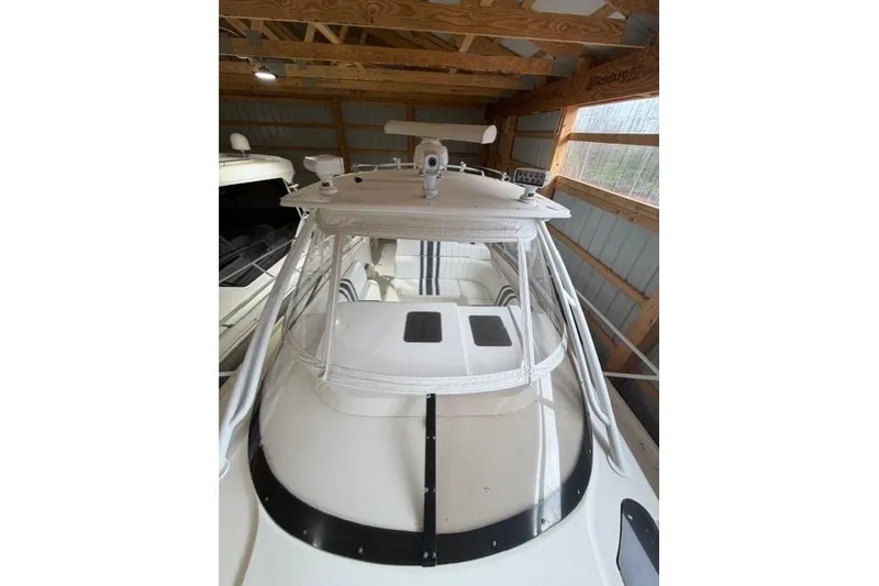 Slide: The Image of 2009 Intrepid 377 Walkaround boat in a wooden boathouse, top view. - 8