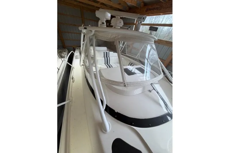 Slide: The Image of 2009 Intrepid 377 Walkaround boat with enclosed cockpit, stored indoors. - 9