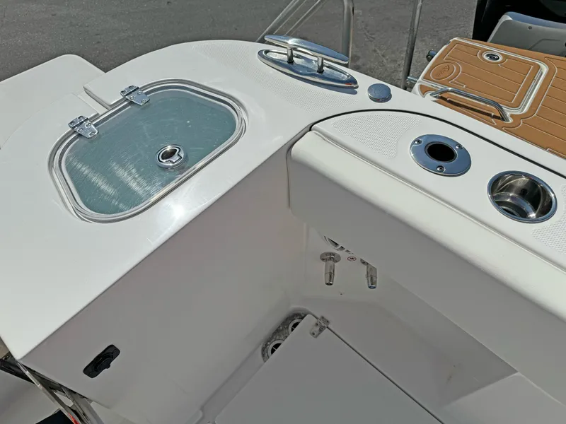 Slide: The Image of 2025 Edgewater 340CC boat deck with storage and cup holders. - 18